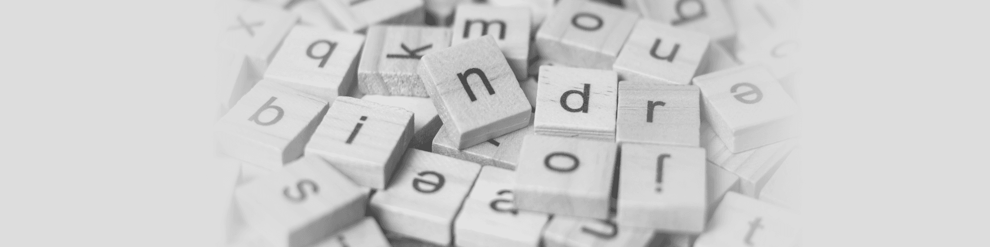 An AI-generated illustration of a jumbled pile of square tiles with lowercase letters on them.